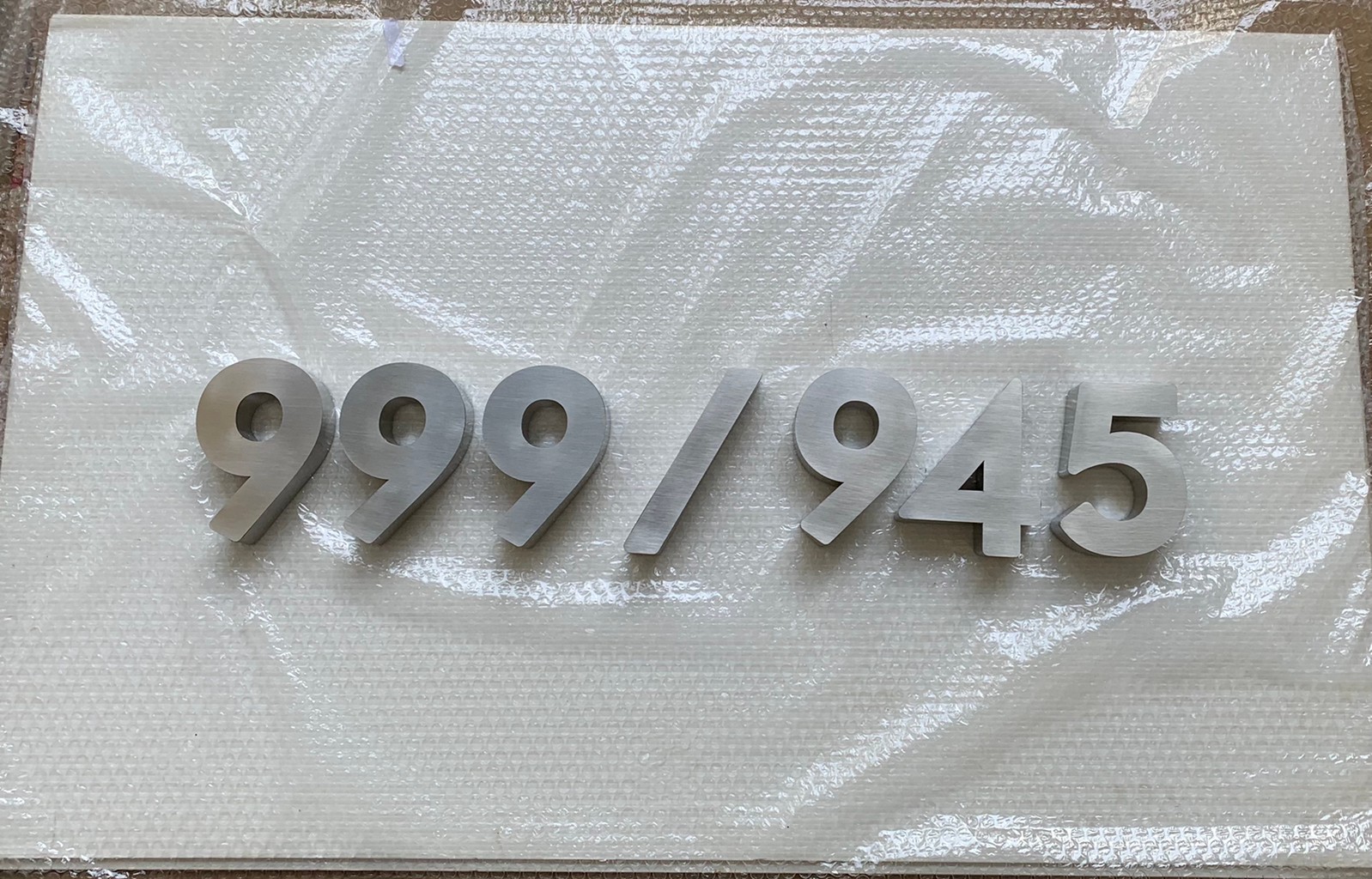 งานป้ายบ้านเลขที่ 999/945